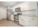 Bright kitchen featuring stainless steel appliances, including a refrigerator, oven, and microwave at 2405 Brick Dr., Longs, SC 29568