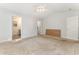 Neutral primary bedroom with ceiling fan, ensuite bathroom, and walk-in closet at 2405 Brick Dr., Longs, SC 29568