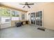 Enjoy this screened porch with ceiling fan, neutral walls and floors, and sliding door leading to the backyard at 2405 Brick Dr., Longs, SC 29568