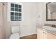 Well-lit half bath featuring vanity and wood-style flooring at 265 South Causeway Rd., Pawleys Island, SC 29585