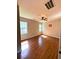 Bright bedroom with wood floors and natural light from two windows at 265 South Causeway Rd., Pawleys Island, SC 29585