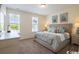Cozy bedroom with large windows and a comfortable queen-sized bed at 2800 Cook Circle # C, Myrtle Beach, SC 29577