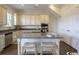 Modern kitchen with stainless steel appliances, granite countertops, a central island and barstool seating at 2800 Cook Circle # C, Myrtle Beach, SC 29577