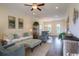 Bright living room with hardwood floors, ceiling fan, modern furniture, and plenty of natural light at 2800 Cook Circle # C, Myrtle Beach, SC 29577