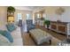 Inviting living space showcasing stylish furniture, an area rug, and seamless flow to the dining area and kitchen at 2800 Cook Circle # C, Myrtle Beach, SC 29577