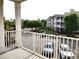 This balcony offers a great view of the well-kept grounds and convenient parking at 290 Woodlands Way Nw # 10, Calabash, SC 28467