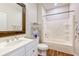 Bathroom with white vanity and updated shower-tub combination at 290 Woodlands Way Nw # 10, Calabash, SC 28467