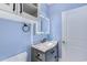 Bathroom featuring a marble vanity, updated sink, and storage at 290 Woodlands Way Nw # 10, Calabash, SC 28467