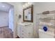 Bathroom with a modern vanity and wood-look flooring at 290 Woodlands Way Nw # 10, Calabash, SC 28467