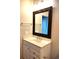 Bathroom features a vanity with chrome fixtures and a decorative framed mirror at 290 Woodlands Way Nw # 10, Calabash, SC 28467