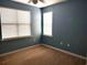 Cozy bedroom features neutral carpet, fresh blue paint and bright, natural light at 290 Woodlands Way Nw # 10, Calabash, SC 28467
