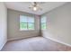 Bedroom with neutral colored walls, carpeted floor, and fan at 290 Woodlands Way Nw # 10, Calabash, SC 28467