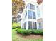 Charming condo building with brick accents, screened in porches, and beautifully landscaped grounds at 290 Woodlands Way Nw # 10, Calabash, SC 28467
