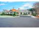 Beautifully landscaped clubhouse featuring elegant architecture and manicured grounds at 290 Woodlands Way Nw # 10, Calabash, SC 28467