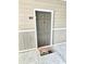 Welcoming front door with unit number and fun welcome mat at 290 Woodlands Way Nw # 10, Calabash, SC 28467