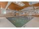 Inviting indoor pool area featuring natural light and comfortable seating at 290 Woodlands Way Nw # 10, Calabash, SC 28467