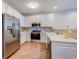 Spacious kitchen with white cabinets, stainless steel appliances, and modern lighting at 290 Woodlands Way Nw # 10, Calabash, SC 28467