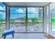 Well-lit porch overlooking landscaped grounds and community buildings, furnished with seating at 290 Woodlands Way Nw # 10, Calabash, SC 28467