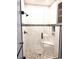 Walk-in shower features stylish tile and a built-in seat for added comfort at 290 Woodlands Way Nw # 10, Calabash, SC 28467