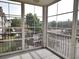 Bright sunroom features screened windows providing views of the landscaped exterior at 290 Woodlands Way Nw # 10, Calabash, SC 28467