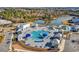 Aerial view of a community pool with pools and lounge areas surrounded by lush landscaping at 305 Calhoun Falls Dr., Myrtle Beach, SC 29579