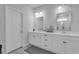Bright bathroom featuring double sinks with modern fixtures and ample counter space at 305 Calhoun Falls Dr., Myrtle Beach, SC 29579
