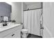 Bathroom with white vanity, modern fixtures, and tiled shower and flooring for a fresh, clean space at 305 Calhoun Falls Dr., Myrtle Beach, SC 29579