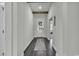 Entryway hallway featuring hardwood floors, white walls, and a decorative rug welcoming you home at 305 Calhoun Falls Dr., Myrtle Beach, SC 29579