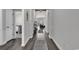 Hallway with hardwood floors and neutral walls leading to the living spaces and bedrooms at 305 Calhoun Falls Dr., Myrtle Beach, SC 29579