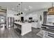 Beautiful kitchen boasting white cabinets, stainless appliances, and a spacious center island at 305 Calhoun Falls Dr., Myrtle Beach, SC 29579