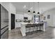 Bright kitchen featuring a large island with seating, white cabinetry, and modern appliances at 305 Calhoun Falls Dr., Myrtle Beach, SC 29579