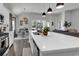 Bright eat-in kitchen showcasing a large island with quartz counters and stainless steel appliances at 305 Calhoun Falls Dr., Myrtle Beach, SC 29579