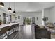 Bright living room with a kitchen view, patio access, and modern furnishings at 305 Calhoun Falls Dr., Myrtle Beach, SC 29579