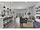 Open-concept living area featuring modern decor, fireplace, and sliding glass doors to the patio at 305 Calhoun Falls Dr., Myrtle Beach, SC 29579
