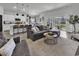 Spacious living room showcasing an open layout with kitchen, dining, and outdoor access at 305 Calhoun Falls Dr., Myrtle Beach, SC 29579