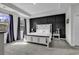 Well-lit main bedroom showcasing a dark accent wall and large windows at 305 Calhoun Falls Dr., Myrtle Beach, SC 29579