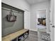 Mudroom featuring an organization station with hooks, a bench, and cubbies for shoes and storage at 305 Calhoun Falls Dr., Myrtle Beach, SC 29579