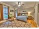 Charming bedroom with hardwood floors, a ceiling fan, and a comfortable rocking chair by the window at 307 Golden Bear Dr. # 3, Pawleys Island, SC 29585