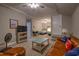 Spacious bonus room with hardwood floors, a comfortable leather sofa, and two twin beds at 307 Golden Bear Dr. # 3, Pawleys Island, SC 29585