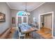 Formal dining room with hardwood floors, chandelier, and French door access to outside at 307 Golden Bear Dr. # 3, Pawleys Island, SC 29585