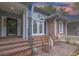Charming front porch with brick steps, Adirondack chairs, and double doors at 307 Golden Bear Dr. # 3, Pawleys Island, SC 29585