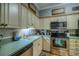 Well-equipped kitchen featuring modern stainless steel appliances and ample cabinet space at 307 Golden Bear Dr. # 3, Pawleys Island, SC 29585