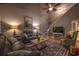 Charming living room featuring hardwood floors, leather sofas, and a beautiful area rug with a high ceiling at 307 Golden Bear Dr. # 3, Pawleys Island, SC 29585