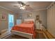 This bright main bedroom features a bed with colorful pillows, white nightstands, and a connecting bathroom at 307 Golden Bear Dr. # 3, Pawleys Island, SC 29585