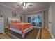 Cozy main bedroom with light gray walls, slider doors to outdoor area, and ceiling fan at 307 Golden Bear Dr. # 3, Pawleys Island, SC 29585