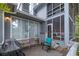 Cozy patio space featuring comfortable seating and access to a screened porch, ideal for outdoor relaxation at 307 Golden Bear Dr. # 3, Pawleys Island, SC 29585