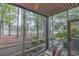 Enclosed porch overlooking landscaped yard with mature trees at 307 Golden Bear Dr. # 3, Pawleys Island, SC 29585