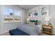 Comfortable bedroom with a window view, stylish decor, and ample natural light at 311 Glade Ct., Loris, SC 29569