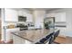 Spacious kitchen with granite countertops, stainless steel appliances, a large island, and ample cabinet space at 311 Glade Ct., Loris, SC 29569