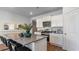 Stylish kitchen island with granite countertops, stainless steel appliances, white cabinets, and modern bar stools at 311 Glade Ct., Loris, SC 29569